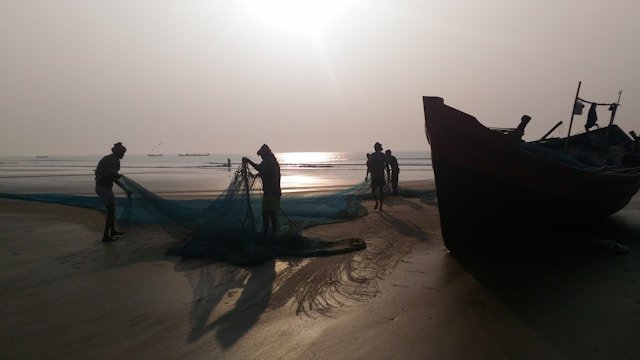 Stilt fishermen at dawn